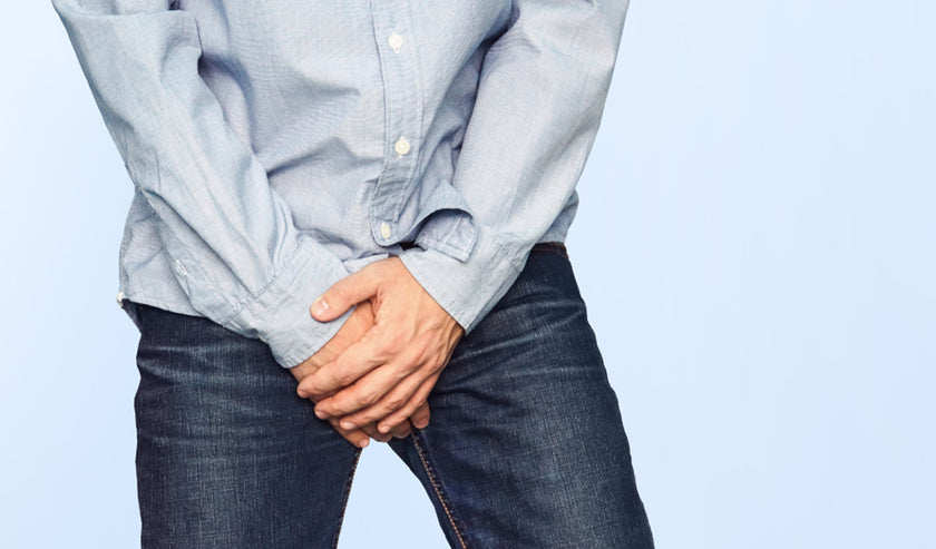 man holding crotch man holding crotch